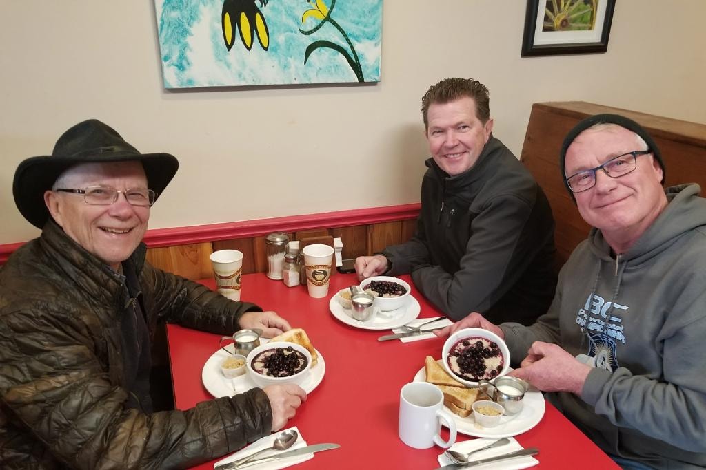 Happy customers dining at Grimm's Deli